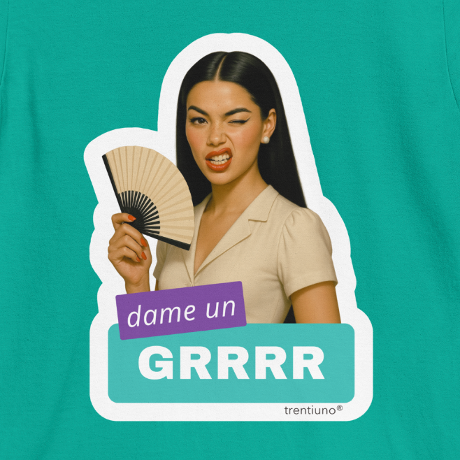 T-shirt with a graphic of a woman holding a fan and text 'dame un GRRRR' on a teal background.